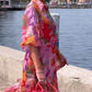 Rode jurk van chiffon met bloemenprint