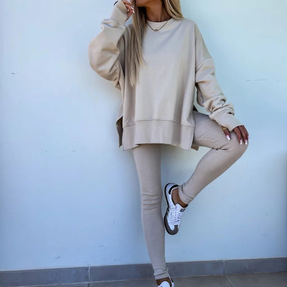 Een tweedelig set voor dames: effen sweatshirt met lange mouwen en een legging